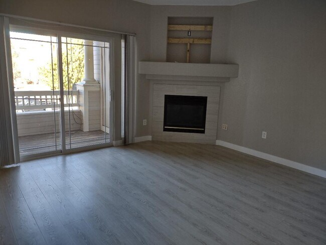 living room w/deck and fireplace - 8318 S Independence Cir
