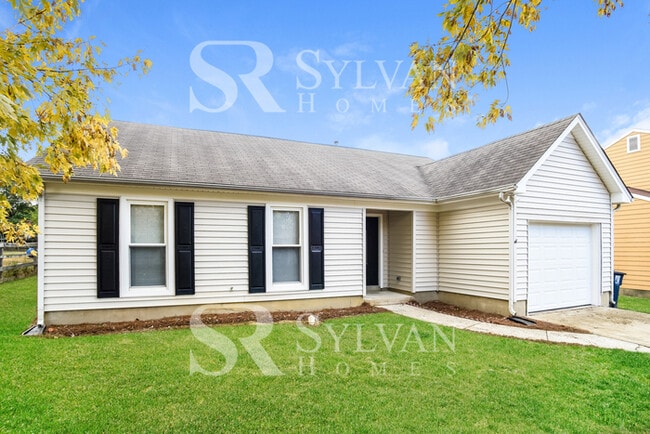 Building Photo - This home exudes a cheerful and welcoming charm!