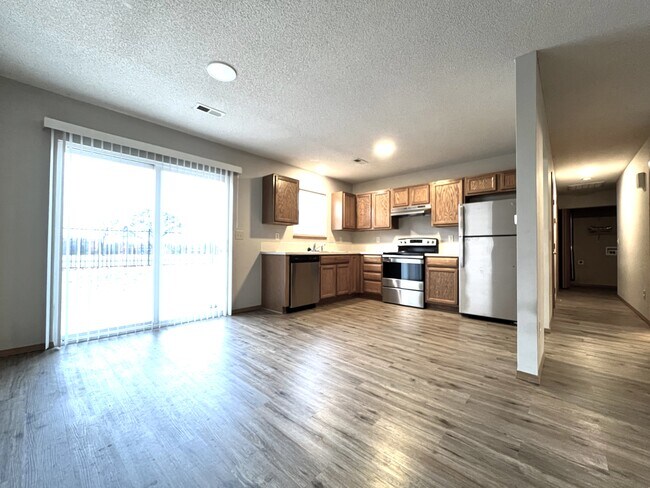Kitchen with stainless steel appliances - 2414 E Conquest St