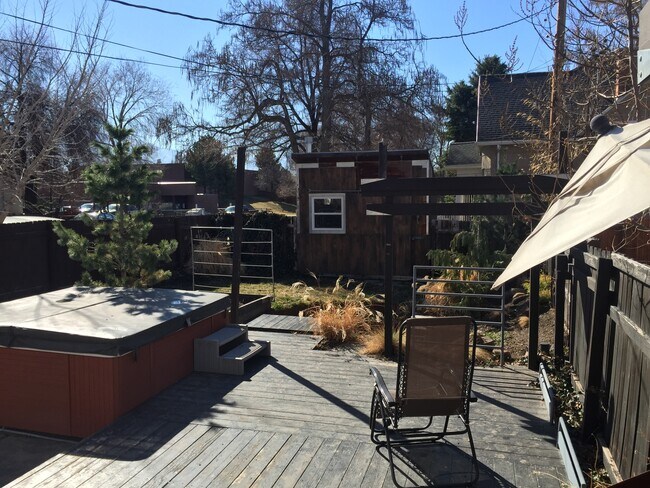 Enjoy your gated backyard, complete with Japanese Zen garden, manicured foliage, hot tub, and craftsman shed. - 986 E 1300 S