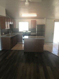 Brand newly remodeled open floor plan kitchen. With brand new granite countertop, cabinets, oven and refrigerator. - 2006 S. Campbell Ave
