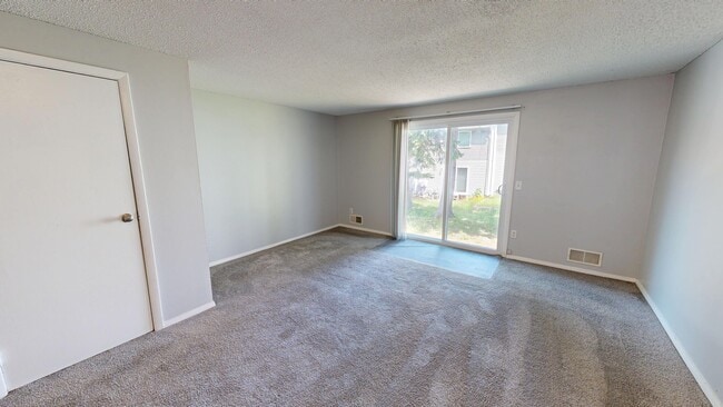 2BR, 1.5BA - 1,100SF - Living Room - North Shore Townhomes