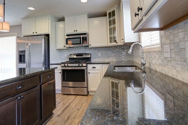 Building Photo - FANTASTIC END UNIT- NEW CARPET AND FRESH P...