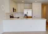 This contemporary single-story home offers 1300 square feet of thoughtfully designed living space. The property boasts three bedrooms, including a generous 200 square foot primary bedroom, and two full bathrooms. The heart of the home is a modern kitchen, complete with white cabinetry, stainless steel appliances, and a convenient breakfast bar. The living area seamlessly connects to the kitchen, creating an open-concept layout ideal for entertaining.

Throughout the home, neutral tones and clean lines dominate, providing a fresh and inviting atmosphere. Large windows in the bedrooms allow ample natural light, while ceiling fans offer comfort and air circulation. The bathrooms feature modern fixtures and finishes, with one including a tub-shower combination.

Practical amenities include a dedicated laundry room and a walk-in closet, enhancing the home's functionality. The flooring varies between plush carpeting in bedrooms and sleek hard surfaces in common areas, adding to the overall modern aesthetic. This well-designed home at 1738 Fennel Flower in Montgomery, TX, combines style and practicality, making it an attractive option for contemporary living.