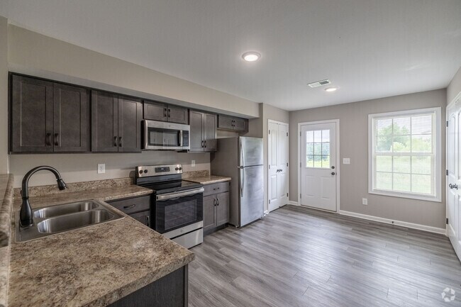 2 habitaciones, 2,5 baños - 1005 pies cuadrados - Cocina - Chalet Village Townhomes