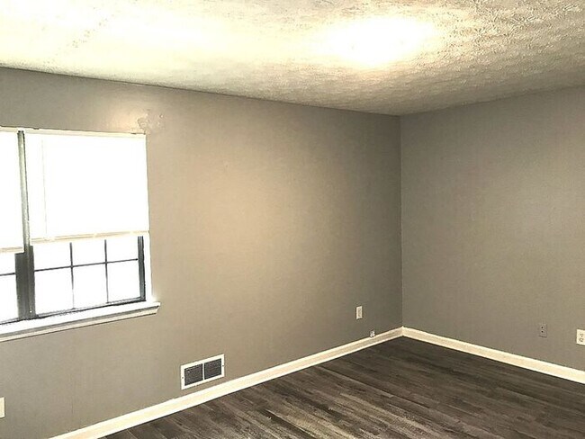 Building Photo - New Faux Wood Flooring and Fresh Paint