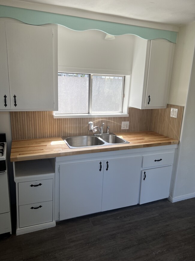 Kitchen with new Countertops, backsplash, and sink - 424 S Broadway