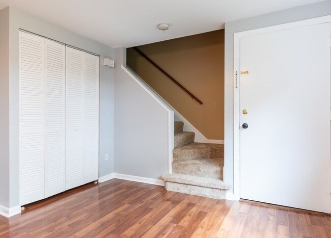 Coat closet, stairs up, main door - 52 Wilson Dr