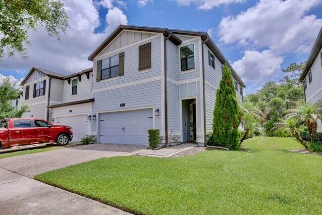 Foto del edificio - Beautiful 4/3.5 Townhome with a Spacious 2 Car Garage Located in Trails at Moss Park - Orlando
