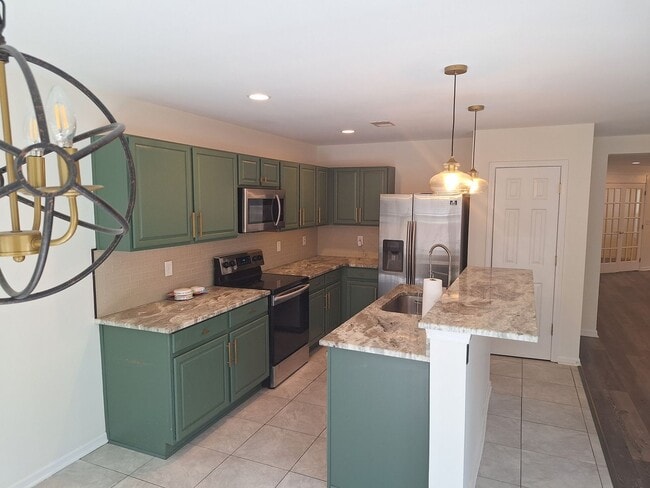 Building Photo - Wonderfully Remodeled Three Bedroom Home i...