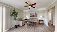 Located at 11401 Mesa Dr in Little Rock, AR, this single-floor, one-bedroom, one-bathroom residence offers a thoughtfully organized layout that maximizes comfort and functionality. The living room serves as the heart of the home, featuring light wood-style flooring, crown molding, a ceiling fan with light fixture, and a patio door that invites natural light into the space. The neutral color palette throughout creates a clean, welcoming atmosphere.

The kitchen is outfitted with white cabinetry, gray laminate countertops, a stainless steel double-basin sink, and white appliances including a range and dishwasher. The adjacent dining area accommodates a round dining table, making it an efficient and comfortable space for everyday meals.

The bedroom offers plush carpeting, a ceiling fan, ample closet space, and softly neutral walls that provide a restful environment. The bathroom features wood-style flooring, a full tub and shower combination with warm earth-toned tile surround, a white vanity with gray countertop, and clean, bright finishes throughout.

This well-maintained residence combines practical design with comfortable living, making it an ideal space for those seeking a move-in ready home in Little Rock.