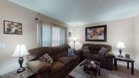Located at 95 S Westmoor Ave in Newark, Ohio, this two-story home offers a well-organized layout across both levels. The living room provides a welcoming atmosphere with plush carpeting, multiple windows dressed with sheer curtains and blinds that allow natural light to fill the space, and a textured ceiling overhead. The kitchen is equipped with dark wood cabinetry, ample counter space, and includes a full suite of appliances — refrigerator, electric range, and dishwasher — set atop easy-care flooring. Adjacent to the kitchen, the dining area features a ceiling fan, wood-style flooring, and a sliding glass door that opens to a view of the outdoor fencing, bringing in additional natural light. A half bathroom is conveniently located on the main level. The staircase connects the main floor to the upper level, where multiple carpeted bedrooms are situated. The bedrooms offer comfortable proportions with neutral-toned walls and textured ceilings, each providing a quiet, functional retreat. The layout as seen in the overhead schematic view clearly illustrates the efficient two-story floor plan, making this home a practical and comfortable residence in Newark, Ohio.