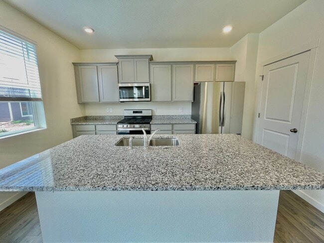 Building Photo - Spacious 4-Bedroom Wellington Home with 3-Car Garage, Loft & Fenced Backyard!