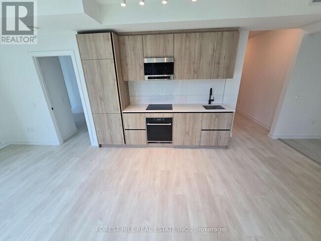 Photo du bâtiment - 117-1117 Broadway Ave