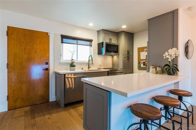 Large white quartz Kitchen - 18203 Coastline Dr