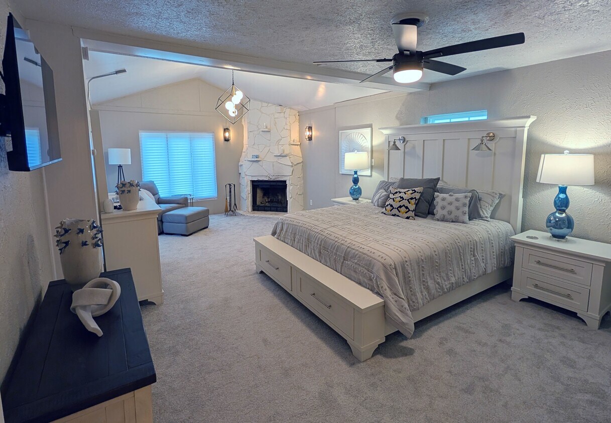 Master Bedroom with King and Electric Fireplace - 3408 25th St