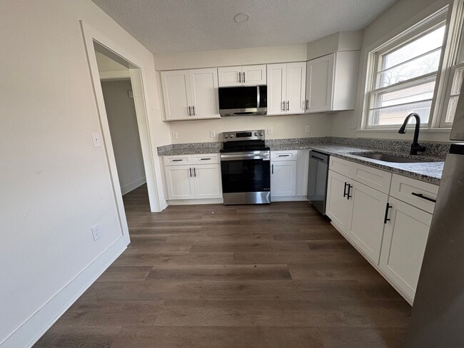 Building Photo - Fully Renovated 3BR/1.5BA – Prime Location + Lawn Care Included