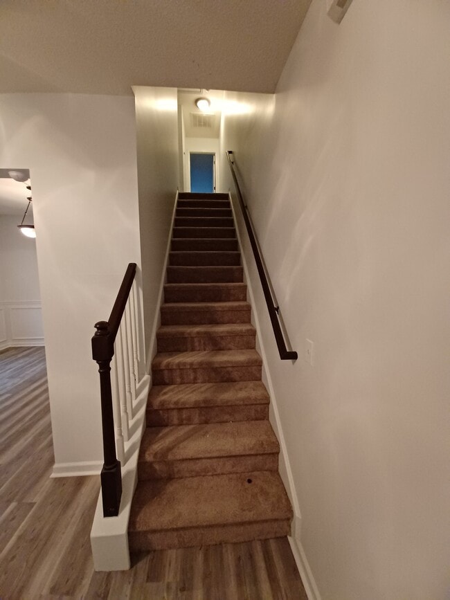 Stairs to bedrooms - 100 Palmetto Park Cir