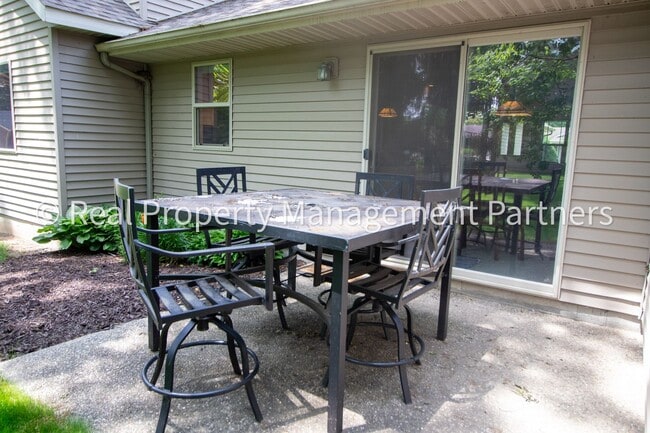 Building Photo - Spacious 3BR Townhome in Lowell | Nature Views & Maintenance-Free Living