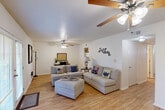 Located at 2300 General Meyer Ave in New Orleans, LA, this two-story home offers a functional and comfortable layout spread across two well-proportioned floors. The main level features a welcoming entrance that opens into a bright, open living room with warm hardwood-style flooring and ceiling fans — a detail consistent throughout the home. The spacious living area flows naturally toward the dining room, which benefits from natural light through a large window, making it an inviting space for gatherings. The galley-style kitchen is lined with warm wood cabinetry, ample counter space, and includes a gas range, double sink, and full-size refrigerator, with a direct view into the dining area. Three full bathrooms serve the home, each well-appointed with vanities and mirrors. The four bedrooms are distributed across both floors, each featuring ceiling fans and hardwood-style flooring. The primary bedroom is a comfortable, private retreat with a window allowing in natural light. Additional highlights include multiple closets — seven in total — providing excellent storage, two staircases connecting the floors, hallways that ensure easy circulation, and a utility room for added practicality. This home combines efficient use of space with a warm, livable character throughout.