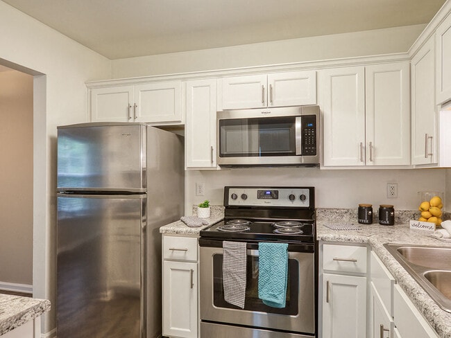 Stainless steel appliances in remodeled kitchen - Colonial Towne Apartments