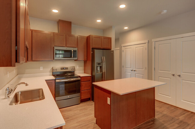 Kitchen with island - Olympus Court Apartments