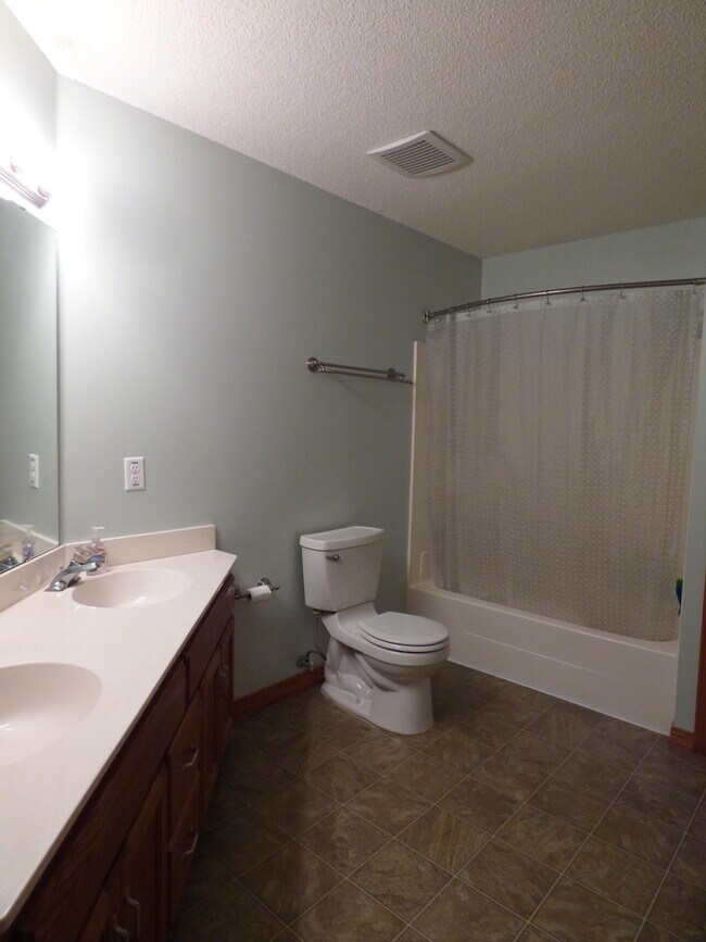 Upstairs full bath is very spacious; 3 good-sized bedrooms on this floor also - 8475 168th St W