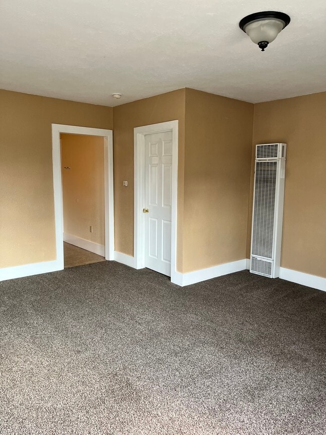 living room looking at bedroom door and kitchen - 441 16th St SE