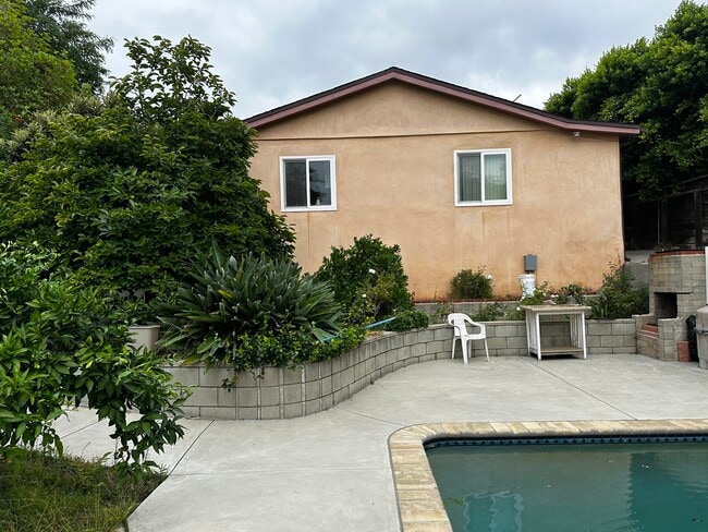 Back wall of the unit & backyard - 1054 E Providencia Ave