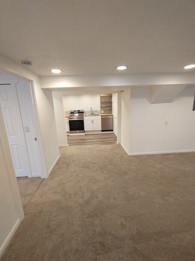 Living room facing kitchen - 4370 S Falcon St