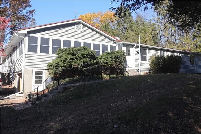Side of main house, entrance of back area - 281 Lake Rd