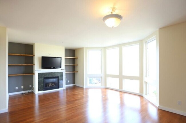 2nd floor to ceiling bay windows living room - 3215 21st St
