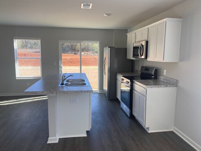 Building Photo - Three Bed Two and a Half Bath Townhome for...