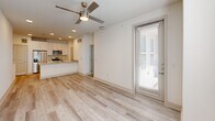 Located at 945 Blakey Ln in Bastrop, TX, this 2-bedroom, 1-bathroom home offers a well-designed, single-story layout with modern finishes throughout. The open-concept living and kitchen area creates a seamless flow, anchored by light wood-style plank flooring and recessed lighting. A ceiling fan adds both style and comfort to the main living space, which receives natural light through a glass entry door fitted with blinds.

The kitchen is a standout feature, showcasing granite countertops, a single undermount sink with a pull-down faucet, white cabinetry, stainless steel appliances including a microwave and range, and a peninsula that opens to the living area — ideal for casual dining or entertaining.

Both bedrooms are carpeted and bright, benefiting from natural light through windows dressed with blinds. Ceiling fans are present in each room, enhancing comfort. A dedicated closet provides convenient storage.

The bathroom is well-appointed with wood-look tile flooring, a granite-topped vanity, white cabinetry, and a tub/shower combination featuring elegant vertically-tiled surround in a neutral gray tone. Clean white walls and crisp trim throughout the home create a fresh, move-in-ready aesthetic that suits a variety of styles.