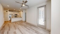 Located at 945 Blakey Ln in Bastrop, TX, this 2-bedroom, 1-bathroom home offers a well-designed, single-story layout with modern finishes throughout. The open-concept living and kitchen area creates a seamless flow, anchored by light wood-style plank flooring and recessed lighting. A ceiling fan adds both style and comfort to the main living space, which receives natural light through a glass entry door fitted with blinds.

The kitchen is a standout feature, showcasing granite countertops, a single undermount sink with a pull-down faucet, white cabinetry, stainless steel appliances including a microwave and range, and a peninsula that opens to the living area — ideal for casual dining or entertaining.

Both bedrooms are carpeted and bright, benefiting from natural light through windows dressed with blinds. Ceiling fans are present in each room, enhancing comfort. A dedicated closet provides convenient storage.

The bathroom is well-appointed with wood-look tile flooring, a granite-topped vanity, white cabinetry, and a tub/shower combination featuring elegant vertically-tiled surround in a neutral gray tone. Clean white walls and crisp trim throughout the home create a fresh, move-in-ready aesthetic that suits a variety of styles.