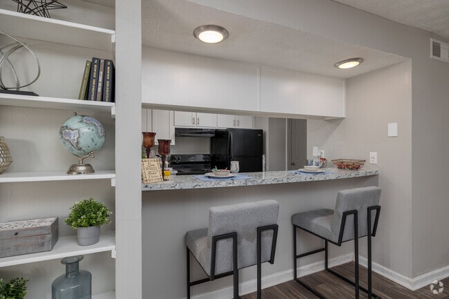 2BR, 2BA - 1,060SF - Bar - Flats and Townhomes
