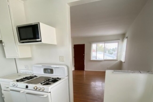 Kitchen-microwave above stove - 2210 24th St