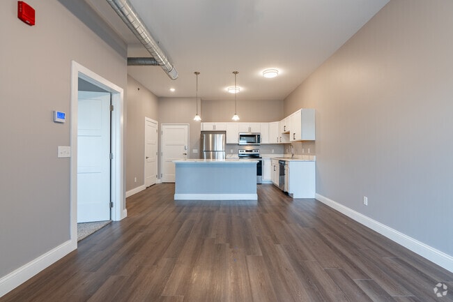 1BR, 1BA Living room to Kitchen - The Elements, LLC