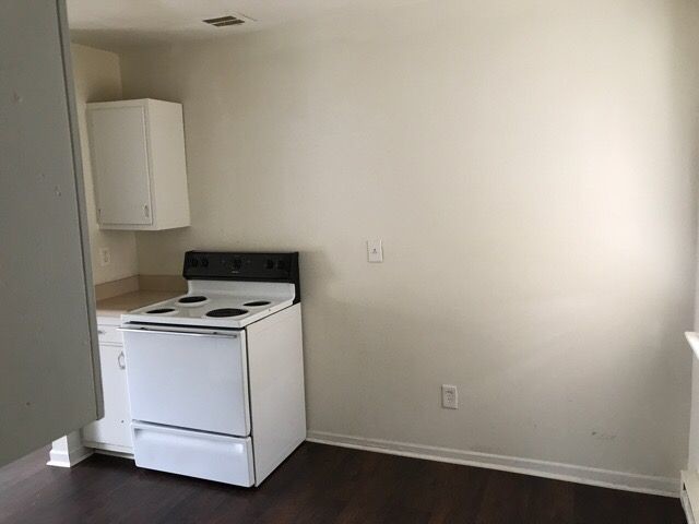 Building Photo - End Unit -Garden-Style Living