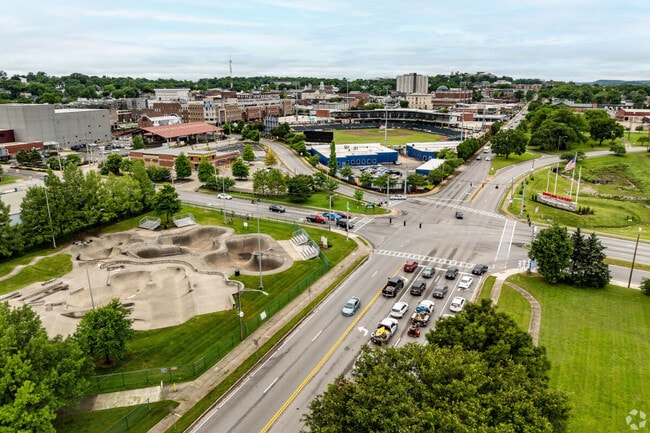 An aerial view of Downtown Bowling Green shows an outdoor skate park and lush trees.
