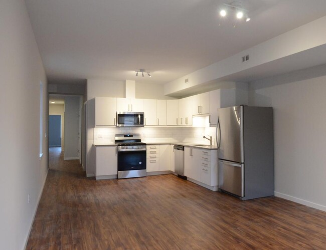 View from living space to kitchen. (bedrooms and baths down the hall) - 904 Main St