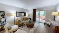Located at 900 E Hillsdale Blvd in Foster City, CA, this single-floor, 2-bedroom, 2-bathroom residence offers a thoughtfully designed layout across a comfortable footprint. Wood-style flooring flows throughout the living areas, lending warmth and continuity to the space.

The living room is bright and inviting, anchored by sliding glass doors that open onto a private balcony with outdoor seating and views of surrounding greenery. A dedicated dining area accommodates a round table for four and features a ceiling fan overhead. Adjacent hallways connect the rooms efficiently, with three closets providing ample storage throughout.

The kitchen is outfitted with white cabinetry, grey countertops, stainless steel appliances — including a range, microwave, dishwasher, and refrigerator — and a deep stainless steel sink, creating a clean, contemporary workspace.

The spacious primary bedroom offers room for a full furniture arrangement, with natural light filtering through large windows dressed with curtains and blinds. The second bedroom is equally comfortable, with wood flooring and direct access to a hallway. Both bathrooms are functional and well-maintained, with one featuring a full tub-shower combination. Neutral tones throughout create a calm, cohesive ambiance well-suited to everyday living.