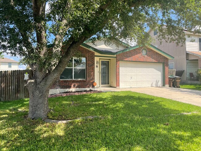 Mature shade trees grace the front windows and door. - 8170 Bent Meadow Dr