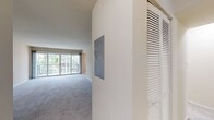 This well-designed apartment offers 1020 square feet of comfortable living space on a single floor. The layout includes two bedrooms, two full bathrooms, a living room, kitchen, and closet space. The primary bedroom is generously sized at 180 square feet, providing ample room for relaxation.

The living area is bright and inviting, featuring plush carpeting and a sliding glass door that leads to a private balcony, allowing natural light to flood the space. The kitchen is a highlight, boasting dark wood cabinetry, stainless steel appliances, and granite countertops. The mosaic tile backsplash adds a touch of elegance, while the wood-look flooring provides durability and style.

Both bedrooms are carpeted for comfort and include ceiling fans and ample closet space with louvered doors. The bathrooms are modern and functional, featuring large vanities with plenty of counter space, oversized mirrors, and shower/tub combinations.

Throughout the apartment, neutral wall colors create a blank canvas for personal decor. The unit also includes in-unit laundry facilities, adding convenience to daily life. With its thoughtful design and quality finishes, this apartment offers a comfortable and stylish living environment.