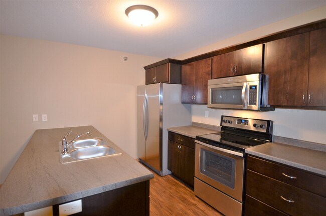 Kitchen w/ Stainless Steel Appliances - 420 11th St N