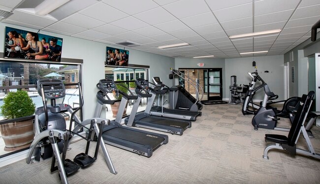 Fitness center with cardio and strength equipment - Park Place Apartments