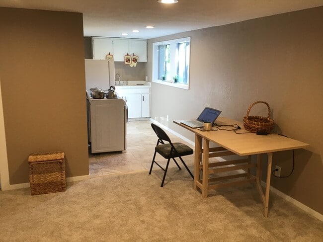 Work table with kitchen view. - 17405 Ashworth Ave N
