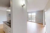 Located at 9150 Wyandotte St E in Windsor, Ontario, this well-appointed unit offers three bedrooms, two bathrooms, and a thoughtfully designed single-floor layout. The open-concept living, dining, and kitchen area serves as the heart of the home, featuring light wood laminate flooring and neutral grey tones throughout that create a clean, cohesive aesthetic. Large sliding glass doors in the living area flood the space with natural light and open directly onto a private balcony with outdoor views. The kitchen is positioned adjacent to the main living space and includes standard cabinetry and a sink with dark countertops. The primary bedroom is a generously sized retreat, while the two additional bedrooms offer comfortable space, each with the same warm wood flooring and neutral walls. Baseboard heaters are present in the bedrooms, and windows allow for natural light. The two bathrooms include a full bathroom with a tiled tub-shower combo and modern fixtures, and a second bathroom for added convenience. Two closets provide practical storage throughout the unit. The overall ambiance is bright, clean, and move-in ready, suited for a variety of living arrangements.