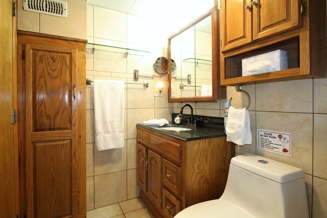 Fully tiled bathroom with granite vanity - 78 Elm St