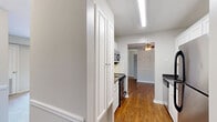 Located at 100 Pinegate Cir in Chapel Hill, NC, this one-bedroom, one-bathroom residence offers a well-organized single-floor layout designed for comfortable everyday living. The combined living and dining area is a welcoming space featuring warm hardwood flooring, neutral-toned walls with classic chair rail molding, and sliding glass doors that open to a private balcony overlooking the surrounding brick exterior and greenery, filling the room with natural light.

The kitchen is efficiently designed with white cabinetry, dark speckled countertops, a stainless steel sink, and a built-in dishwasher, providing ample storage and workspace. Adjacent to the main living area, the kitchen flows naturally into the dining and living space.

The bedroom is a comfortably sized room finished with plush carpeting, soft neutral walls, and a window fitted with blinds that allow for both natural light and privacy. A dedicated closet provides convenient storage within the bedroom.

The bathroom features a clean, full-size tub and shower combination with chrome fixtures, maintaining a simple and functional aesthetic. Throughout the home, consistent neutral tones, white trim, and carpet in the bedroom create a cohesive and move-in-ready environment suited for Chapel Hill living.